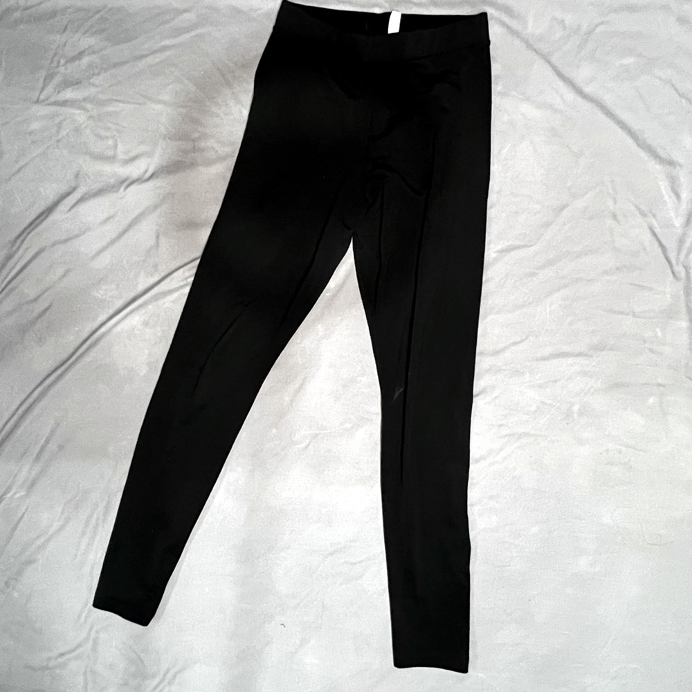 Black skinny woman’s Adidas leggings
